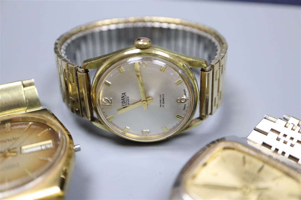 Five assorted wrist watches including Garrard & Rotary.